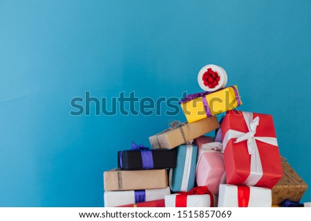 lots of colorful Christmas birthday gifts new year blue background