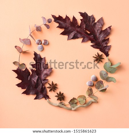 Creative autumn fall thanksgiving day composition with decorative dried leaves. Flat lay, top view, copy space, still life pastel background for greeting card