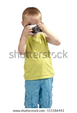 toddler with a photo camera on a white background