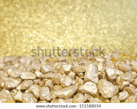 golden stones and gold abstract background with blurred