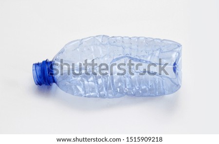 Single empty blue plastic bottle on white background. Waste recycling concept. Garbage. Isolation on white.