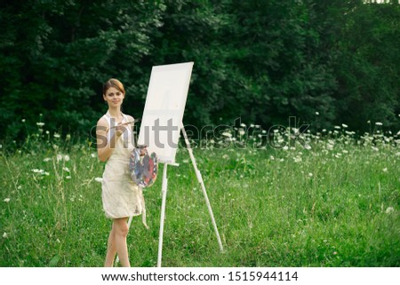 woman model with canvas outdoors