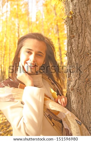 Happy beautiful latin hispanic  girl enjoy the autumn . portrait of smiling nice brunette woman  Copy space for inscription 