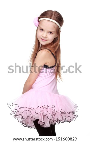 Young ballerina wearing lovely tutu dancing like a swangirl isolated over white background