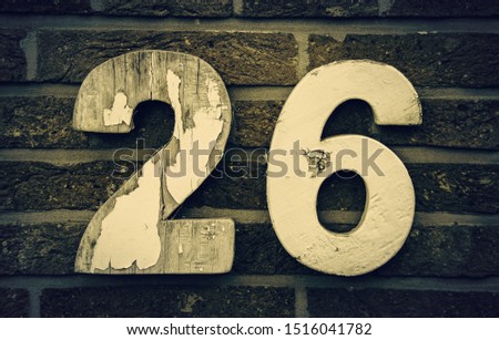 Number twenty six, detail of even number on a wall, postal address