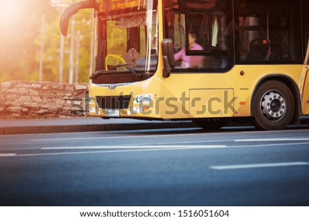 Bus moving on the road in city in early morning