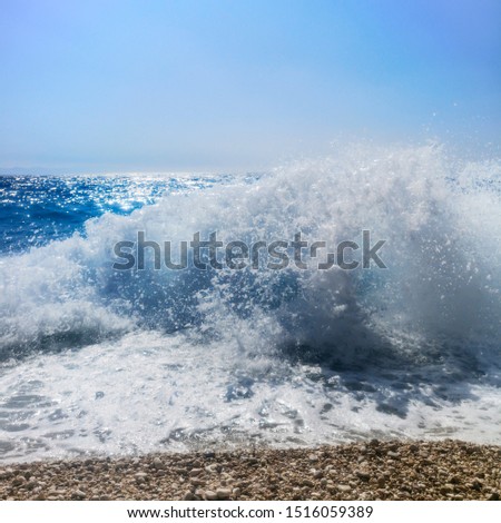 Breaking Wave of Blue Ocean on Pebbles beach Summer Background