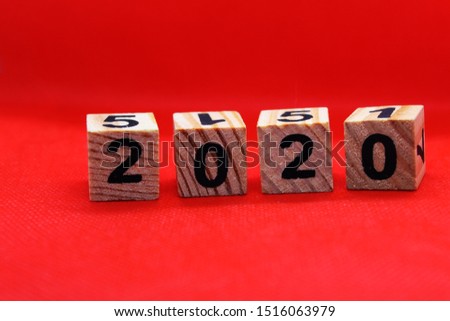 Wooden New Year 2020 calendar on red background