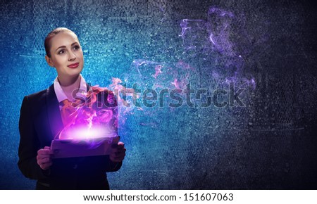 Image of young business woman holding ipad