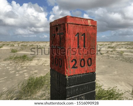 Wooden Beach pole at Schiermonnikoog Island