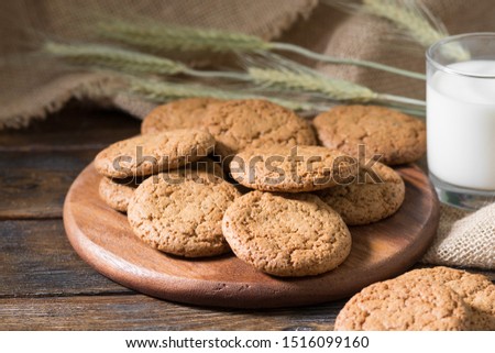 Oatmeal cookies on a wooden round Board. Rustic style