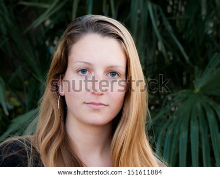 young woman outdoors direct eye contact
