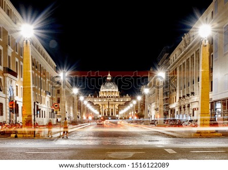 Rome, Italy: Via della conciliazione with the Saint Peter's basilica at the end. Long exposure photography generates colourful horizontal light trails on the picture