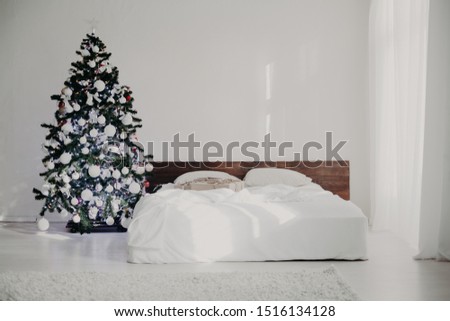 bedroom with christmas new year tree decoration bed