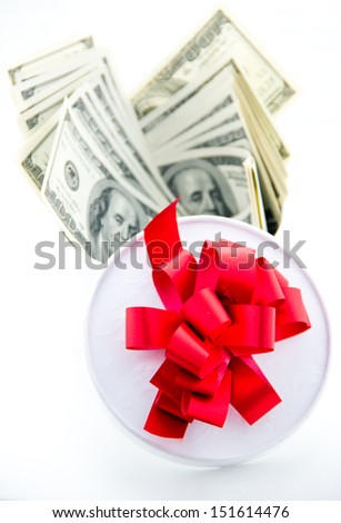 Money and gift box isolated on the white background.