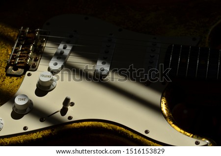 Relic aged gold leaf guitar with white pickguard and knobs