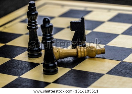 Black and white photo with a picture of a chess Board and chess pieces, Wooden chess pieces on a chess Board