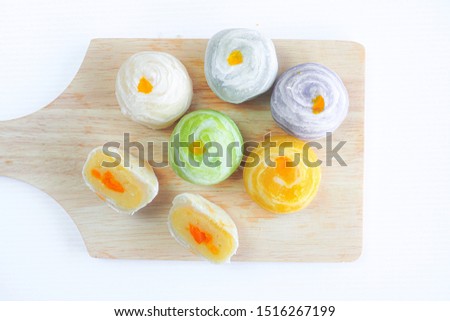 Chinese pastry with sweet mung bean and salted egg. Moon cake or Chinese pastry filled with mung bean paste and salted egg on white background.