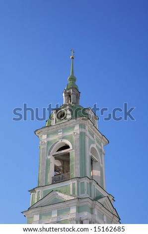 bell tower in city center on sky background