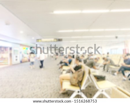 Blur picture of passengers who are sitting and waiting in the airport