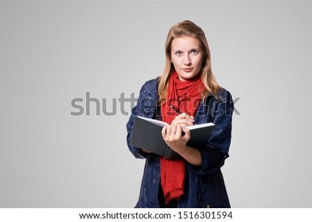Young girl with notebook. Business woman write. Adorable caucasian businesswoman.