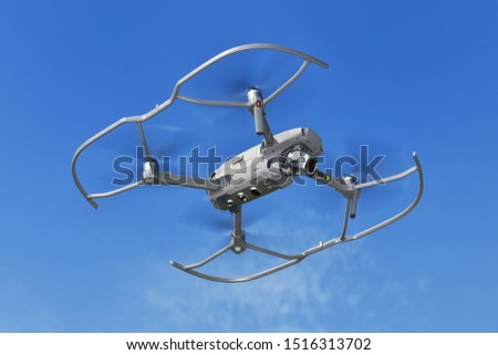 Small drone with propeller guard Royalty-Free Stock Photo #1516313702