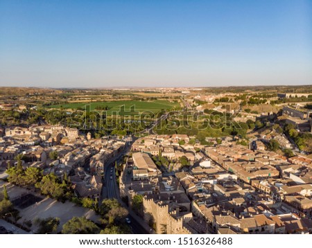 Panorama of the ancient Spanish city of Toledo in the rays of the evening sun. Videography from a drone.
