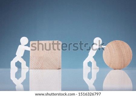 White Two Human Figure Pushing Wooden Block And Circle On Reflective Background