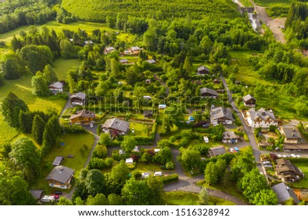Beautiful aerial view of green meadow and villages at Chamonix
