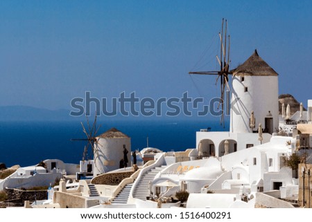 The old windmills of Oia's village on Santorini's island, Greece