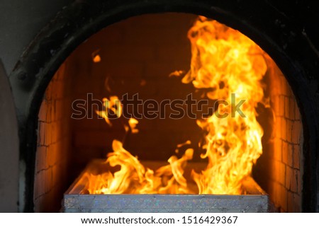 Cremation ceremony by using firewood, dry wood and charcoal to cremate and set fire