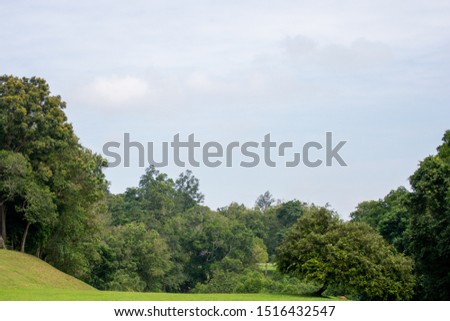 Panorama View of Golf Course with beautiful fairway field. Golf course with a rich green turf and blue bright sky.
