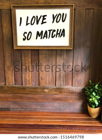 i love you so matcha on the wooden wall. Texture sign.