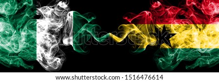 Nigeria vs Ghana, Ghanaian abstract smoky mystic flags placed side by side. Thick colored silky smoke flags of Nigerian and Ghana, Ghanaian