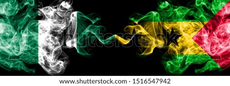 Nigeria vs Sao Tome and Principe abstract smoky mystic flags placed side by side. Thick colored silky smoke flags of Nigerian and Sao Tome and Principe