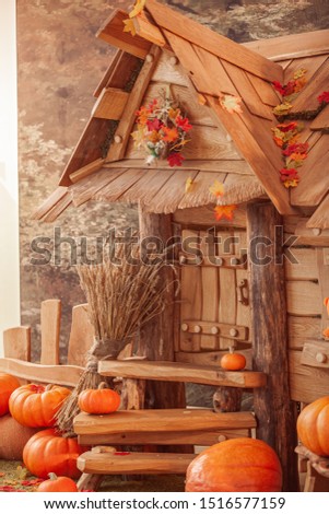 fairytale oak house, interior decor, autumn background with pumpkins.