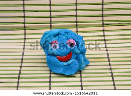 cute dough toy  on wooden background