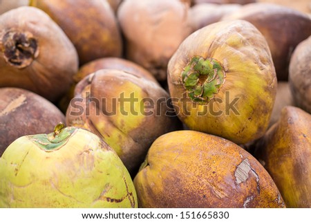 raw green and brown coconuts
