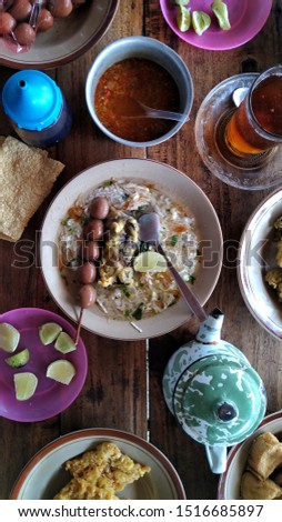 Soto (also known as tauto, or coto) is a traditional Indonesian soup mainly composed of broth, meat, and vegetables. served with side dishes such as tofu, tempeh, cracker, fried chicken, satay egg.
