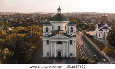 Old architectural building against the backdrop of the autumn city, aerial photography.