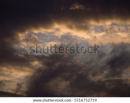 Background of dramatically illuminated stormy clouds