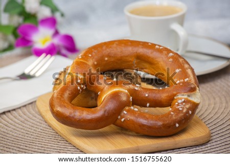Fresh fragrant bread with and coffee beautiful flower is a good breakfast for the body on the table.