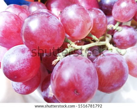 Grapes and oranges are sweet and fresh