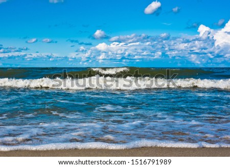The Baltic Sea and blue sky with white clouds in sunny day