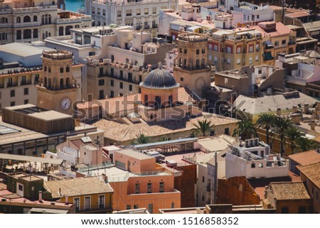 Beautiful wide aerial view of Alicante, Valencian Community, Spain with port of Alicante, beach and marina, with mountains and skyline, seen from Santa Barbara Castle on Mount Benacantil, sunny day
