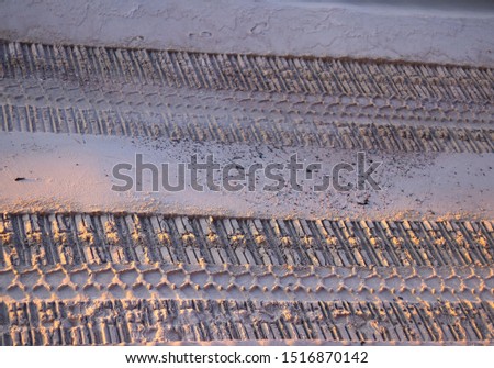 
Tire imprint on sand texture