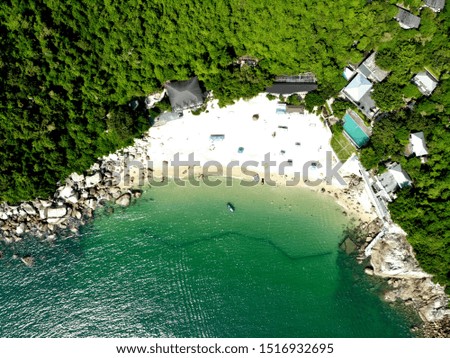 Amazing Egong beach with clear turquoise water, green beautiful hills around and with different water activities. Shenzhen, China.