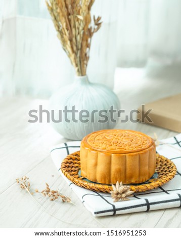 One piece of Mooncakes with nature light nature background, copy space, for food issue. 