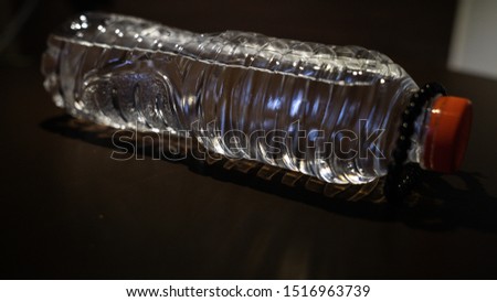 drinking water bottles and pearl bracelets Royalty-Free Stock Photo #1516963739