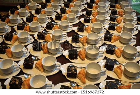 The set of coffee break cup with desserts were prepared for breaking seminar at hotel room.